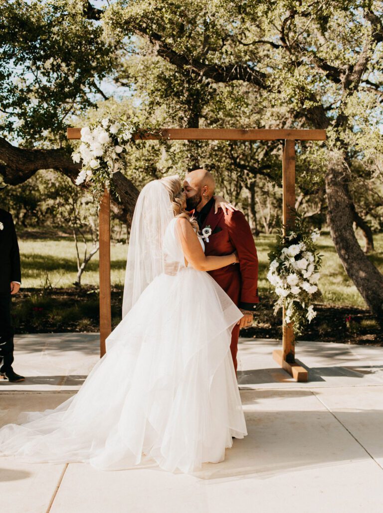 A scenic outdoor wedding ceremony at a Texas Hill Country venue, surrounded by breathtaking natural beauty.