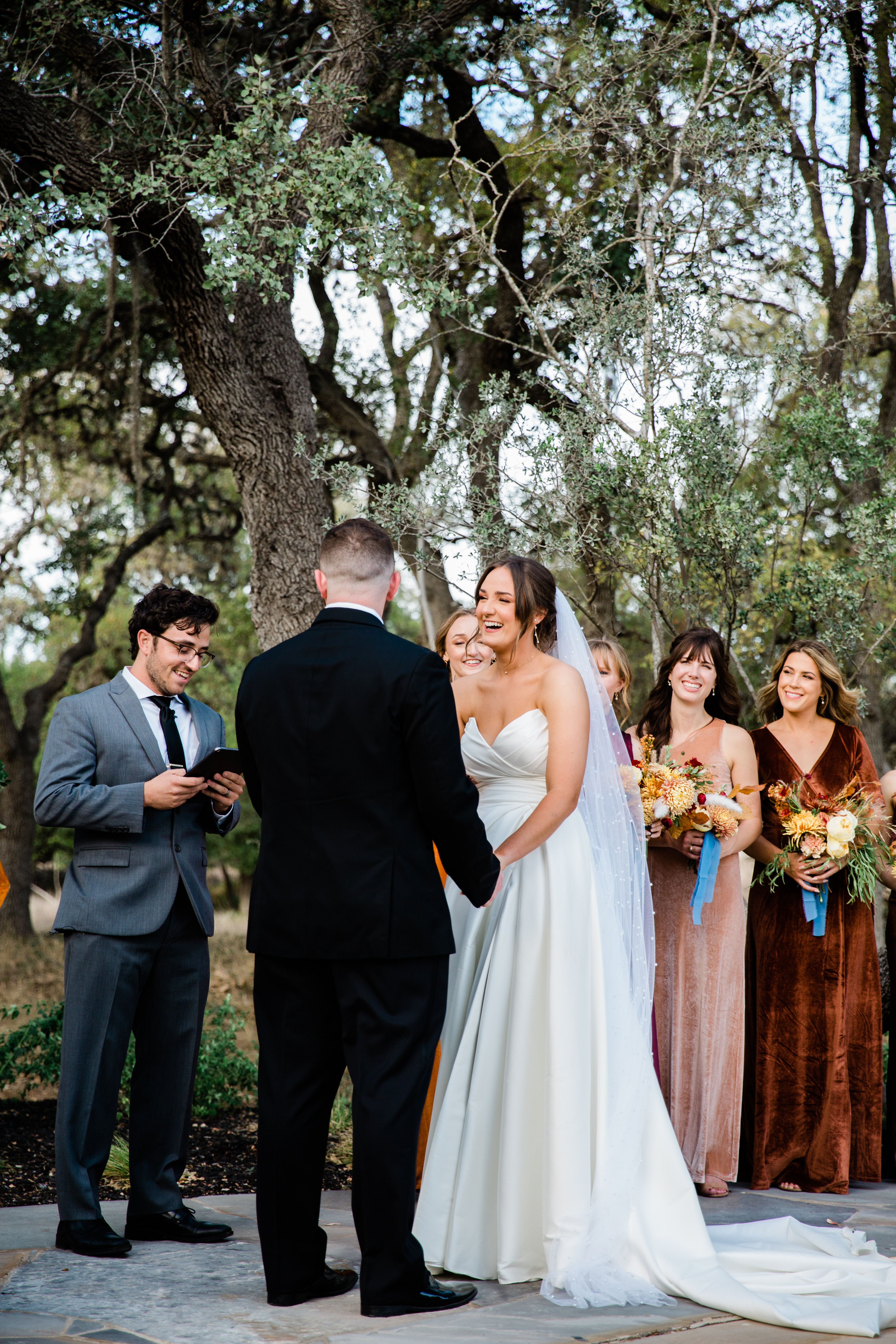 A breathtaking sunset ceremony, casting a warm glow over the couple as they exchange vows.